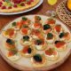 Christmas pancakes with crème fraîche, salmon, and caviar, representing indulgence and the challenges of body image after the holiday season.