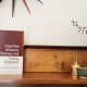 CBT-E book on a shelf, representing cognitive behavioral therapy for eating disorders and body image issues, a key resource in evidence-based treatment.